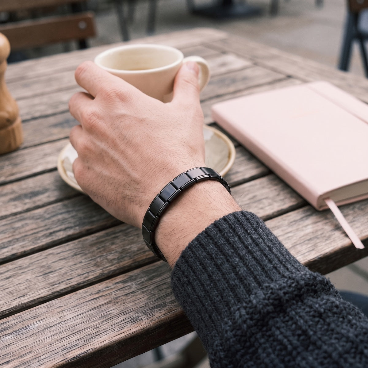 Black Little Links Bracelet Worn At A Cafe